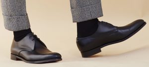 black-shoes-and-grey-trousers